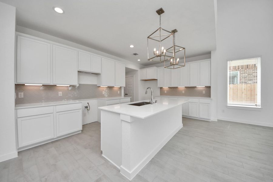 The extended counter area adds both practicality and style, making meal preparation a breeze. Every detail is thoughtfully designed to enhance the kitchen's functionality and aesthetic appeal.