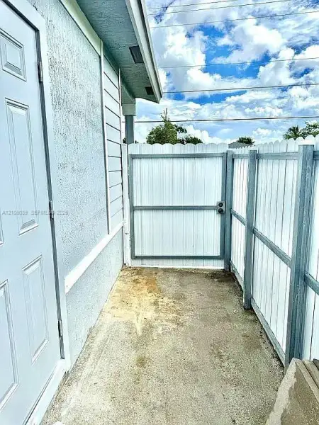 Exterior details and patio area of a home in , Goulds (Image 3).