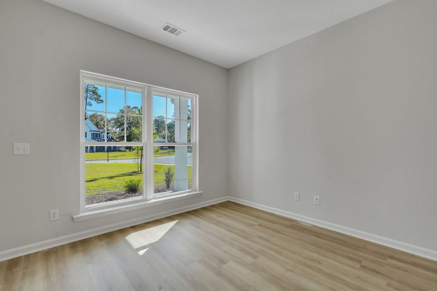 Representative unfurnished interior of a home built from the The Hatteras by Smith Family Homes in Ramsey Landing, Rincon (Image 19).