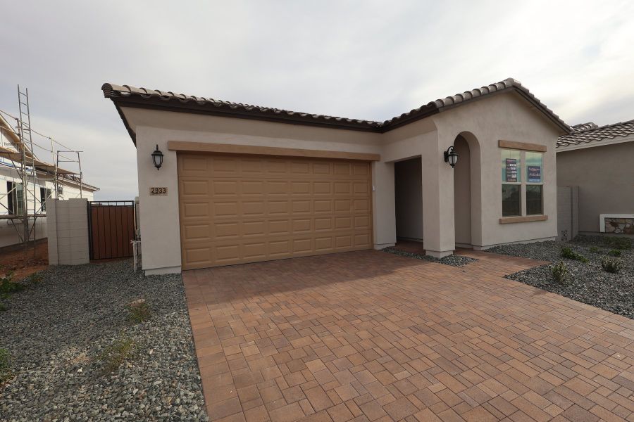Front exterior of a new home in Artesa at Soleo, San Tan Valley, AZ, highlighting curb appeal (Image 2). Front exterior of a new home in Artesa at Soleo, San Tan Valley, AZ, highlighting curb appeal (Image 2).