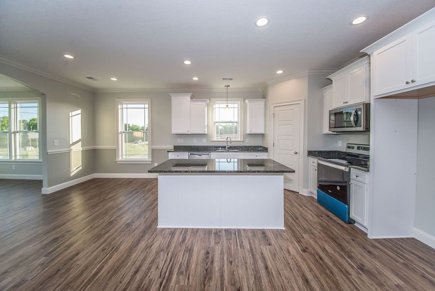 Representative furnished interior of a home built from the Mediterranean by Enchanted Homes in Messer Farms, Inman (Image 9).