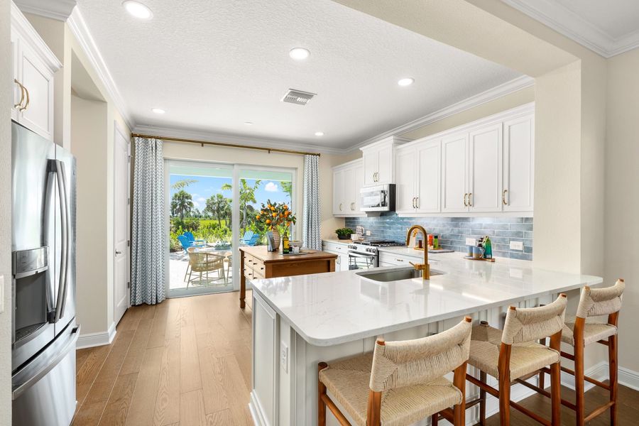 Representative furnished interior of a home built from the Liberty 4 by Neal Communities in Palmera, Venice (Image 10).