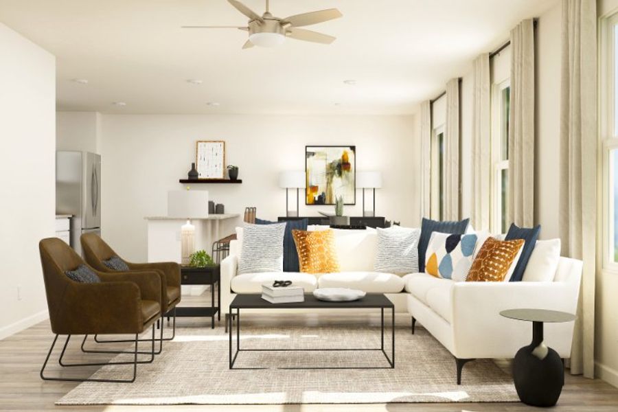 A living room with a white couch and a table. A living room with a white couch and a table.