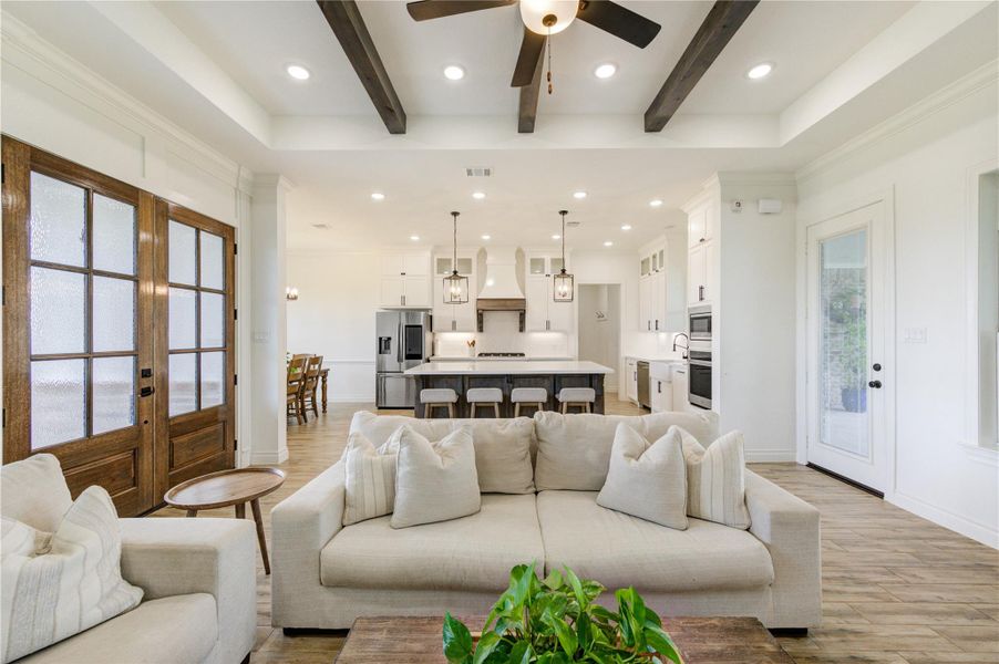 Bright open layout connecting living, dining, and kitchen areas seamlessly