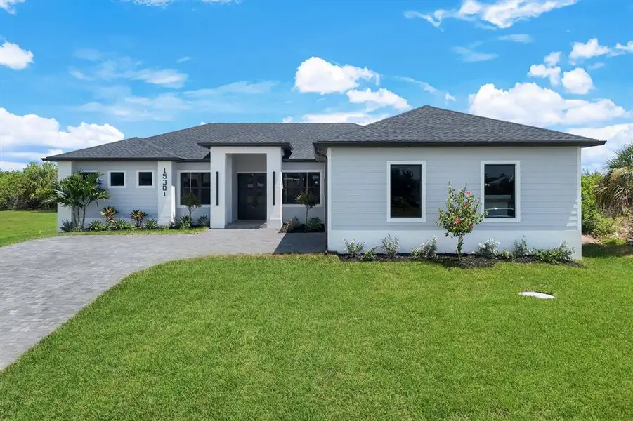 Front exterior of a new home in , Port Charlotte, FL, highlighting curb appeal (Image 1). Front exterior of a new home in , Port Charlotte, FL, highlighting curb appeal (Image 1).