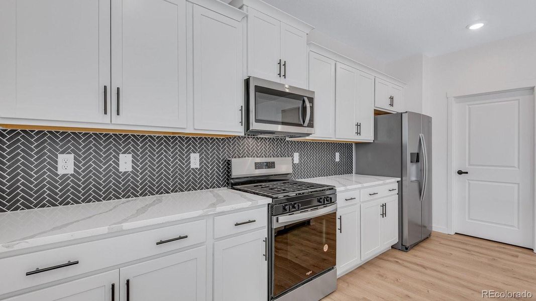 Furnished interior view inside a new home in Trails at Crowfoot, Parker (Image 7).