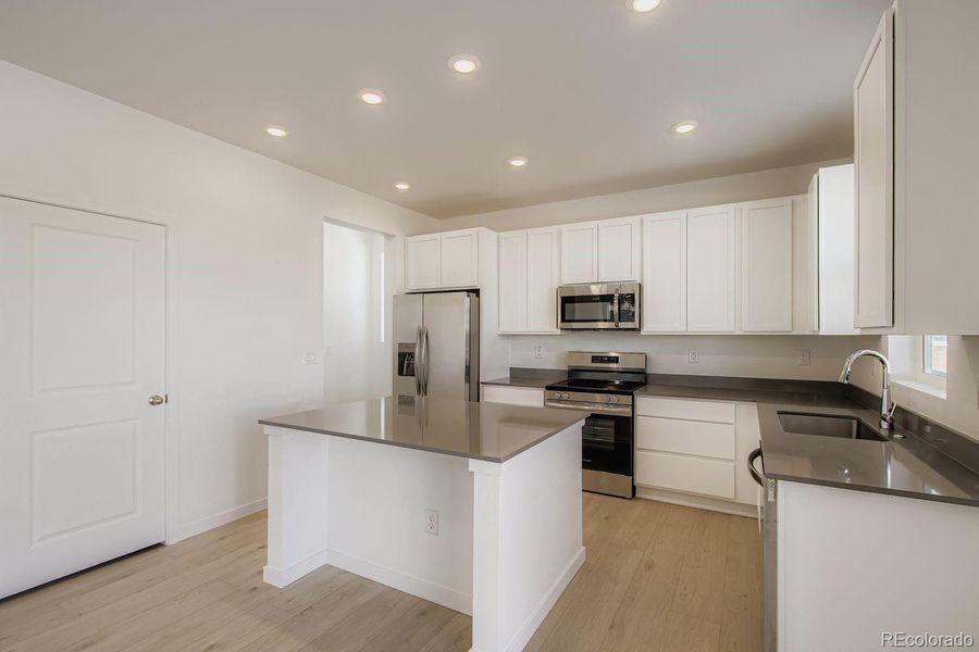 Furnished interior view inside a new home in Ken-Caryl Ranch, Littleton (Image 2).