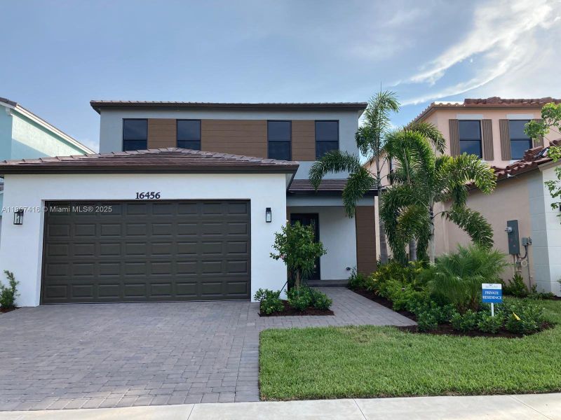 Front exterior of a new home in , Westlake, FL, highlighting curb appeal (Image 23).
