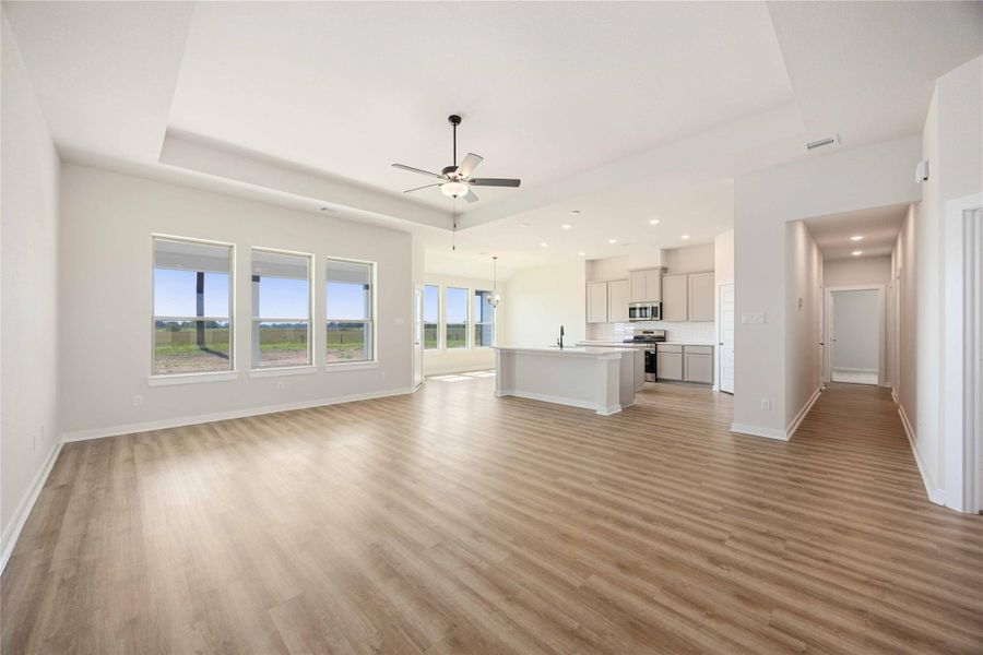 This home features a spacious, open-concept layout and an expansive family room connected to a gourmet kitchen and a bright breakfast area.