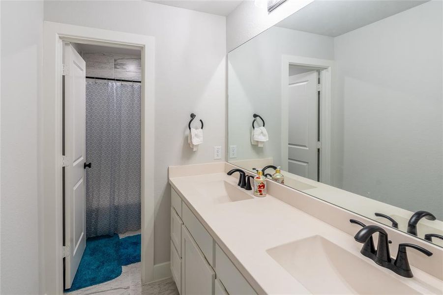 Carpeted bedroom featuring baseboards and vaulted ceiling