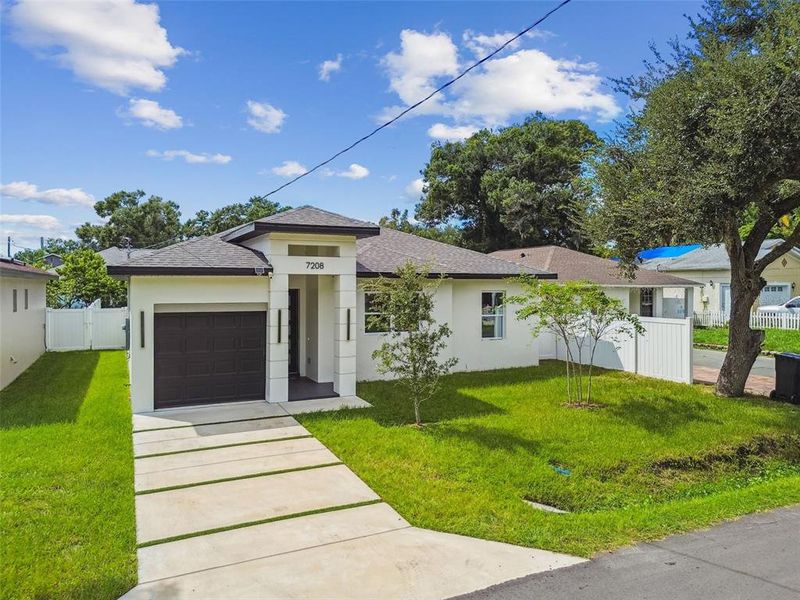 Front exterior of a new home in , Tampa, FL, highlighting curb appeal (Image 37).