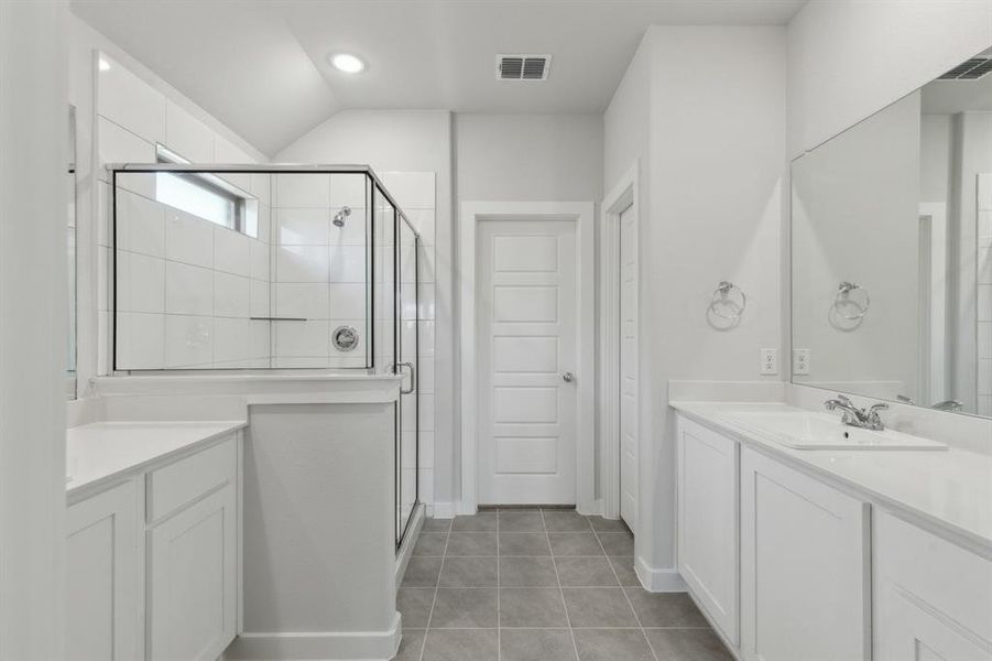 Primary Bathroom in the Heisman home plan by Trophy Signature Homes – REPRESENTATIVE PHOTO