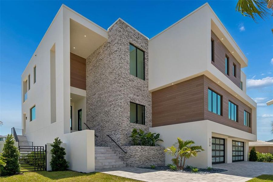 Front exterior of a new home in , Belleair Beach, FL, highlighting curb appeal (Image 29).