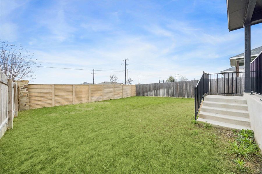 View of fenced backyard