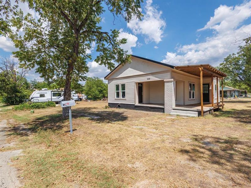 Front exterior of a new home in , Coleman, TX, highlighting curb appeal (Image 13). Front exterior of a new home in , Coleman, TX, highlighting curb appeal (Image 13).