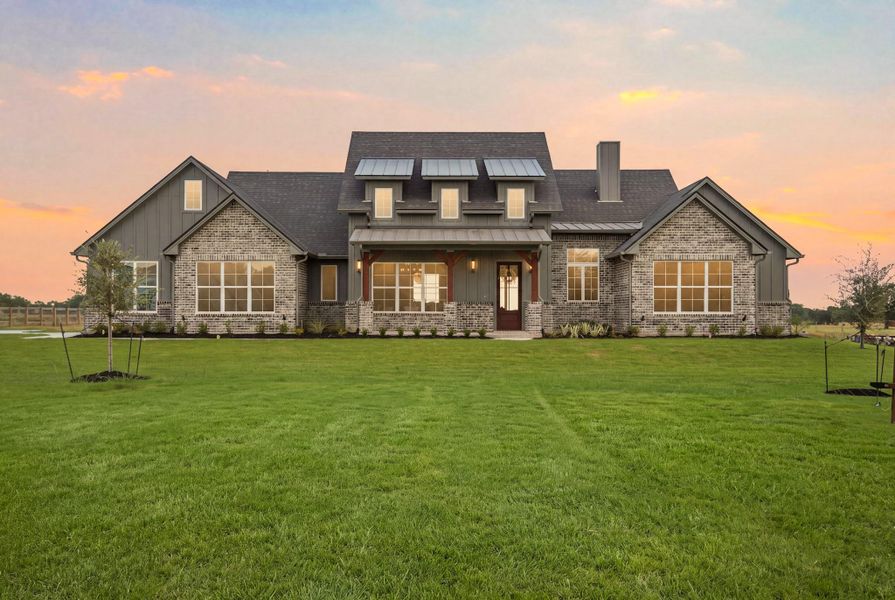 Front exterior of a new home in , College Station, TX, highlighting curb appeal (Image 2). Front exterior of a new home in , College Station, TX, highlighting curb appeal (Image 2).