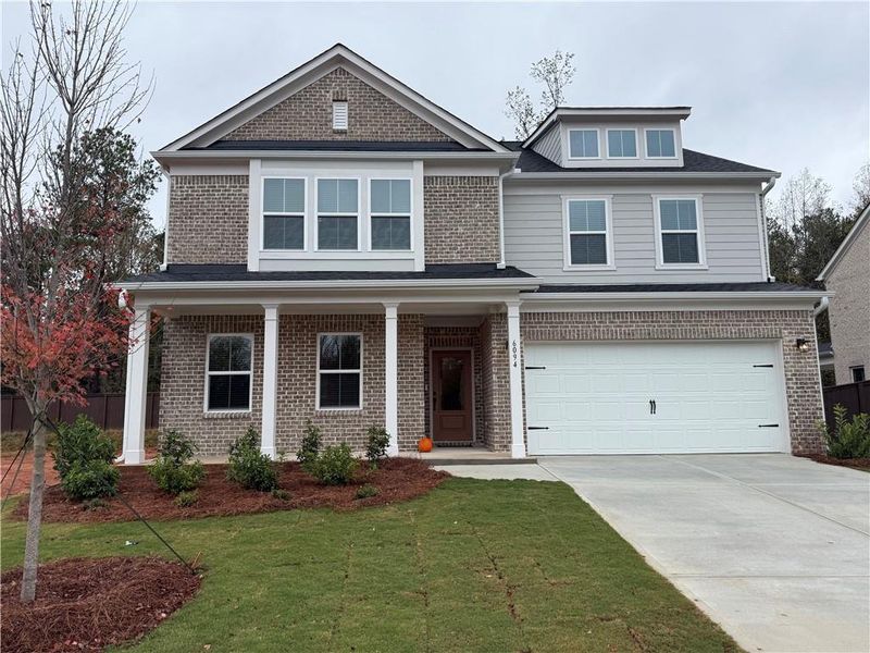 Front exterior of a new home in Briar Creek, Atlanta, GA, highlighting curb appeal (Image 1).