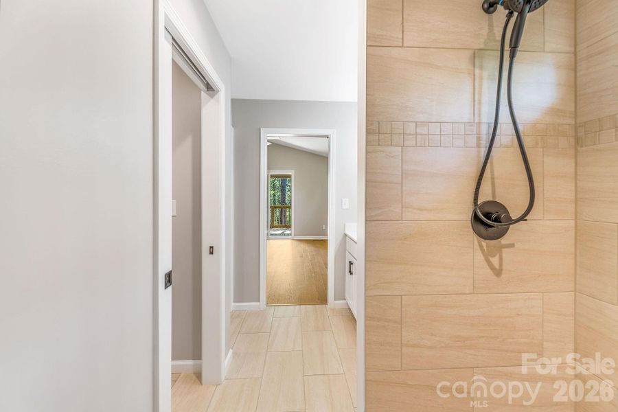 private en-suite bath with tile shower