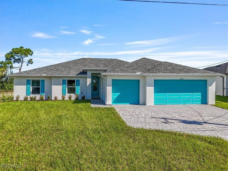 Front exterior of a new home in Cape Coral, Cape Coral, FL, highlighting curb appeal (Image 2).