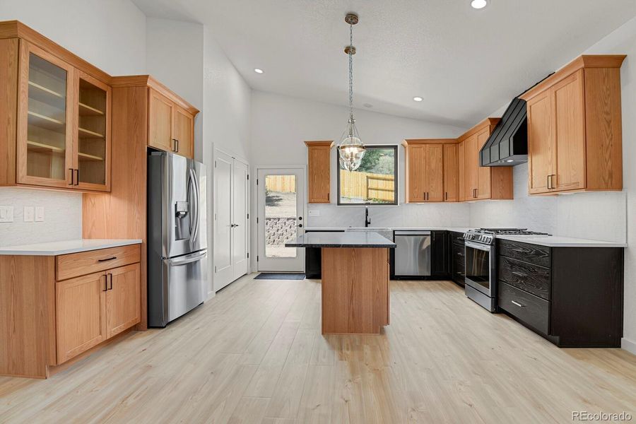 Full suite of LG stainless appliances including gas range and custom fabricated hood vent Full suite of LG stainless appliances including gas range and custom fabricated hood vent