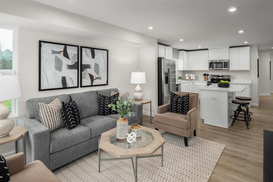 Representative furnished interior of a home built from the Beech by Ryan Homes in Highland Park Condos, White House (Image 7).