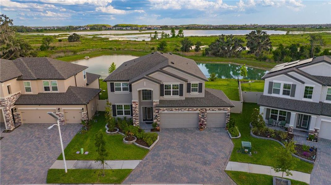 Front exterior of a new home in , Wesley Chapel, FL, highlighting curb appeal (Image 25).