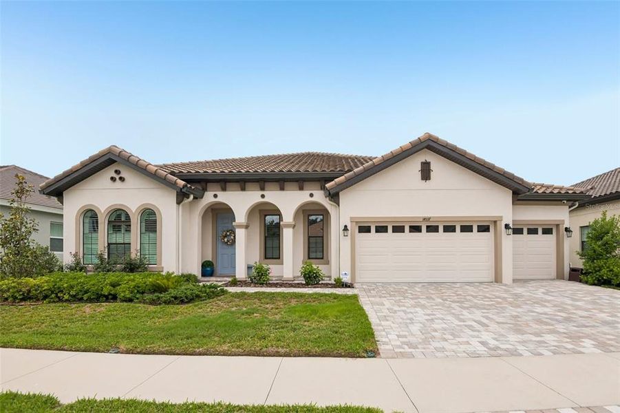 Front exterior of a new home in Hawkstone, Lithia, FL, highlighting curb appeal (Image 22).