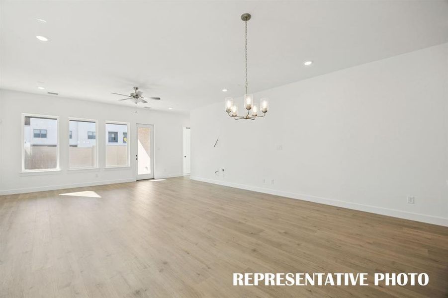 The entire family will love gathering in this spacious, light filled open concept dining-family room!  REPRESENTATIVE PHOTO