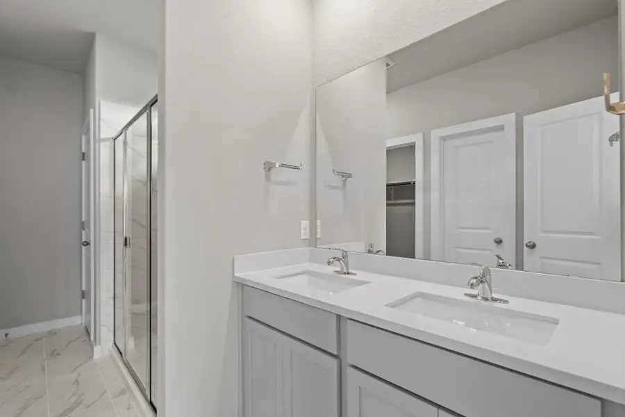 Primary Bath retreat with dual vanities & walk-in shower Primary Bath retreat with dual vanities & walk-in shower