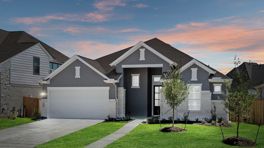 Front exterior of a new home in Jordan Ranch, Fulshear, TX, highlighting curb appeal (Image 2). Front exterior of a new home in Jordan Ranch, Fulshear, TX, highlighting curb appeal (Image 2).