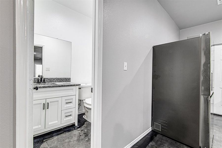 Bathroom featuring toilet and vanity