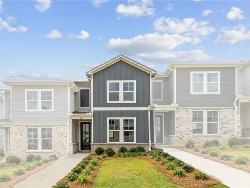 Front exterior of a new home in Stegall Village, Emerson, GA, highlighting curb appeal (Image 2). Front exterior of a new home in Stegall Village, Emerson, GA, highlighting curb appeal (Image 2).