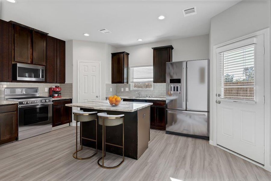 Furnished interior view inside a new home in Enclave at Willis, Willis (Image 4). Furnished interior view inside a new home in Enclave at Willis, Willis (Image 4).