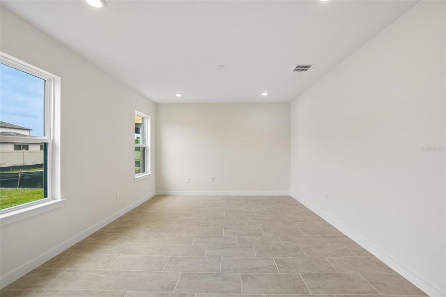 Spacious, unfurnished interior of a new home in Grasslands West, Lakeland (Image 43).