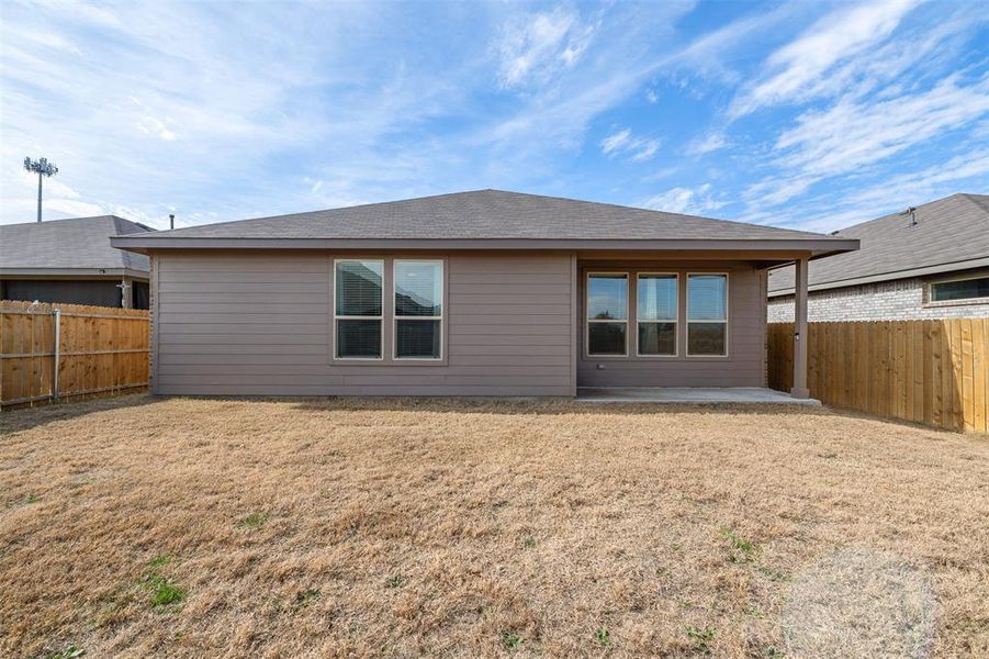 Rear view of property with a patio