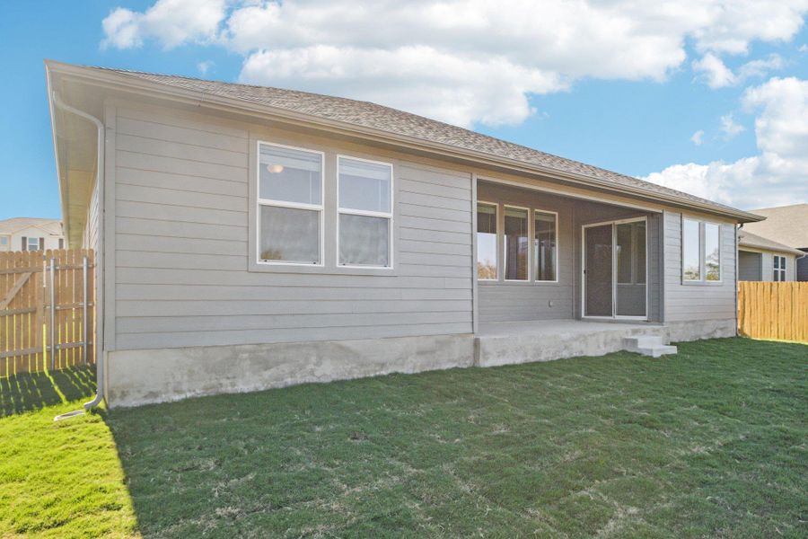 Back of property with a patio