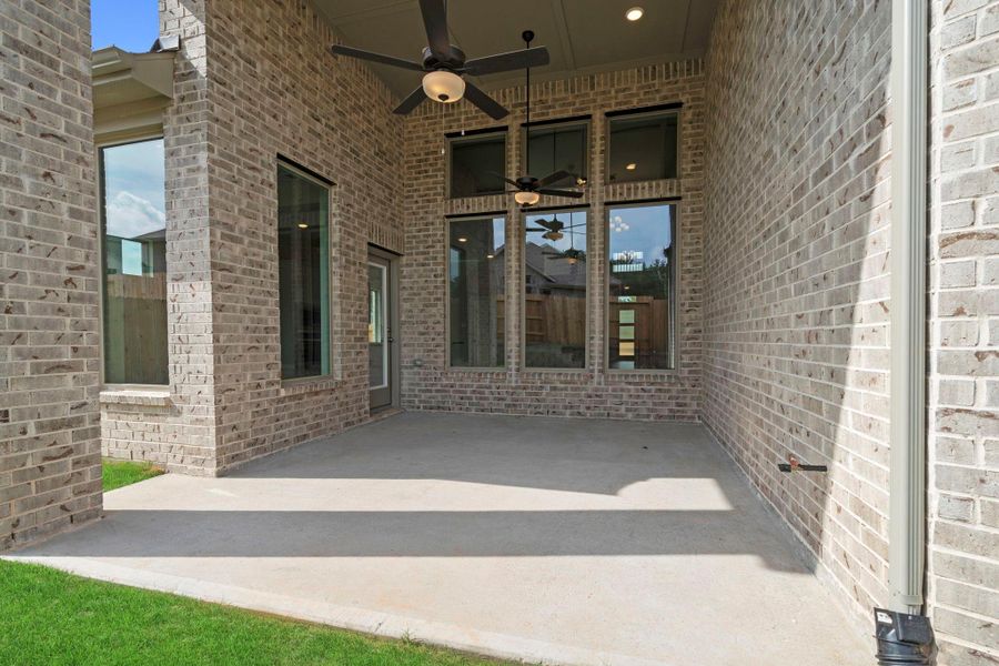 Exterior details and patio area of a home in Wildtree, Magnolia (Image 3).