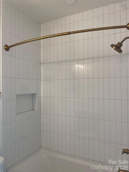 Secondary Bathroom - Tile to the Ceiling with upgraded gold fixtures + a Shower Rod Secondary Bathroom - Tile to the Ceiling with upgraded gold fixtures + a Shower Rod