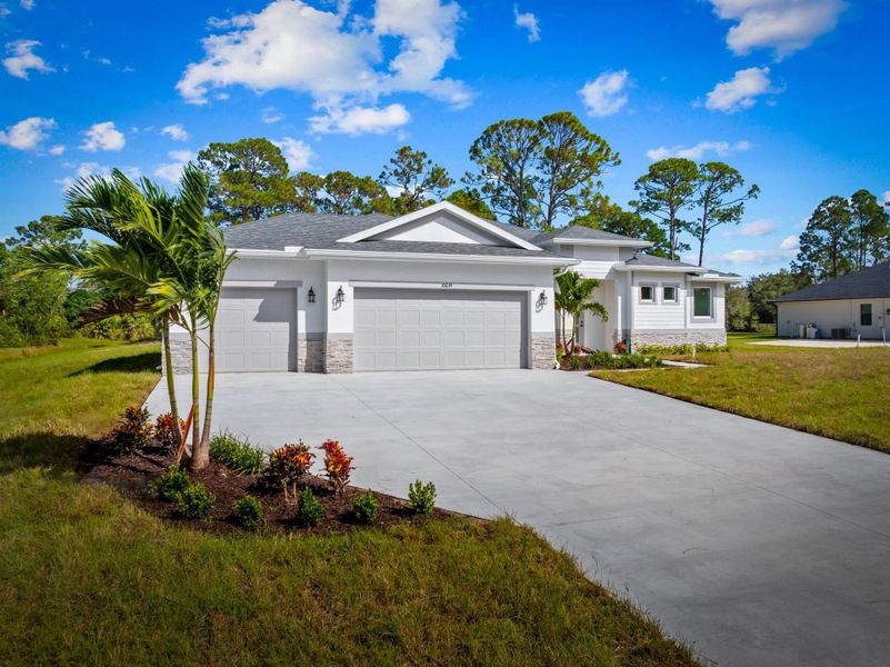 Front exterior of a new home in , Fort Pierce, FL, highlighting curb appeal (Image 22). Front exterior of a new home in , Fort Pierce, FL, highlighting curb appeal (Image 22).