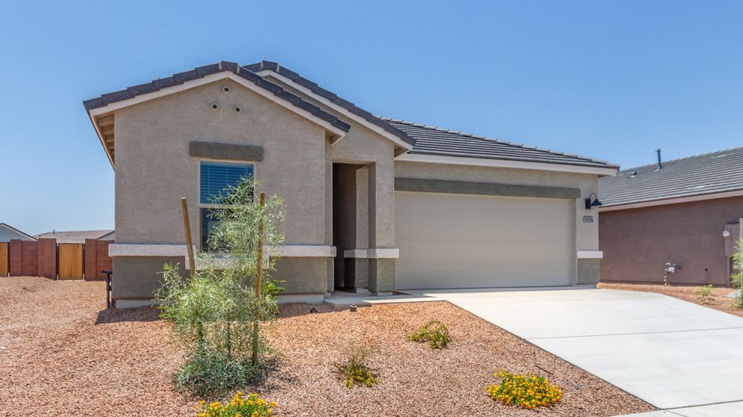 Front exterior of a new home in Barnett Village, Marana, AZ, highlighting curb appeal (Image 20).