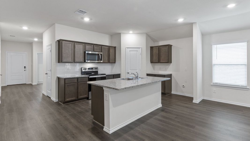 Representative furnished interior of a home built from the X40L Lakeway by D.R. Horton in Valor Farms, Royse City (Image 9).