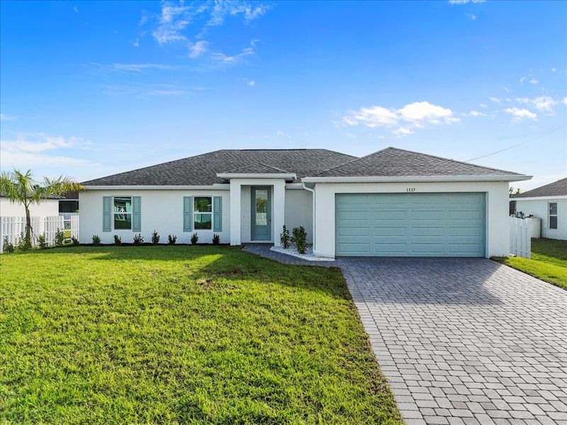 Representative exterior photo of a completed home built from the The Sunset Harbor with Pool by Sunlife Homes LLC in Cape Coral, Cape Coral, FL (Image 21). Representative exterior photo of a completed home built from the The Sunset Harbor with Pool by Sunlife Homes LLC in Cape Coral, Cape Coral, FL (Image 21).