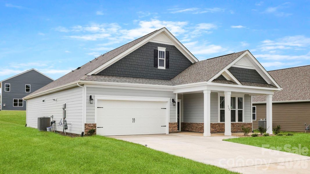 Front exterior of a new home in Tap Root Farms, Fletcher, NC, highlighting curb appeal (Image 1). Front exterior of a new home in Tap Root Farms, Fletcher, NC, highlighting curb appeal (Image 1).