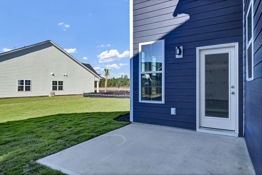 Exterior details and patio area of a home in Grand Park, Leland (Image 3).