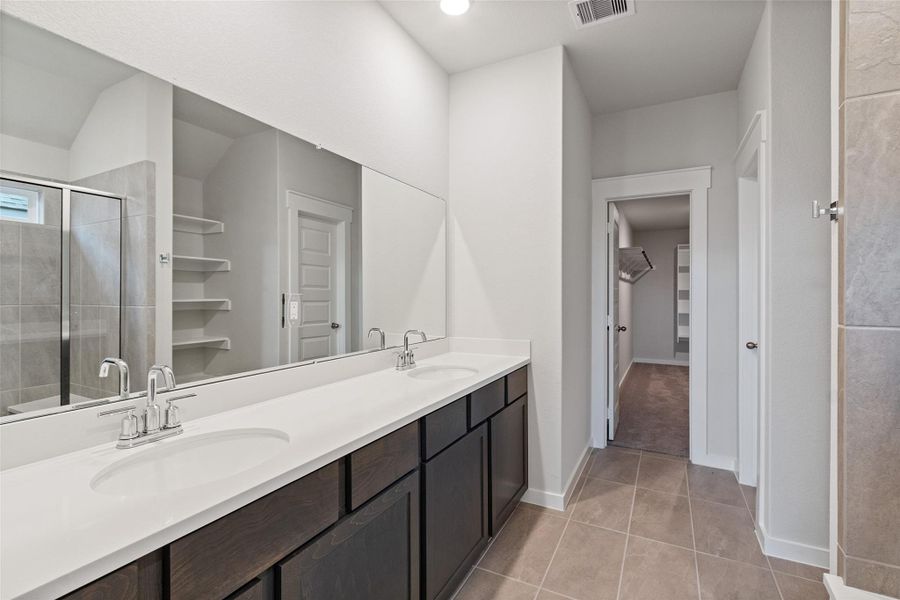 Furnished interior view inside a new home in Sunterra, Katy (Image 11).