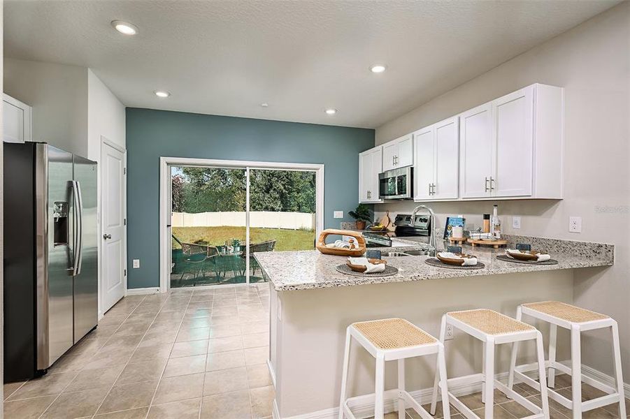 Furnished interior view inside a new home in Westview Community Group Page, Kissimmee (Image 12).