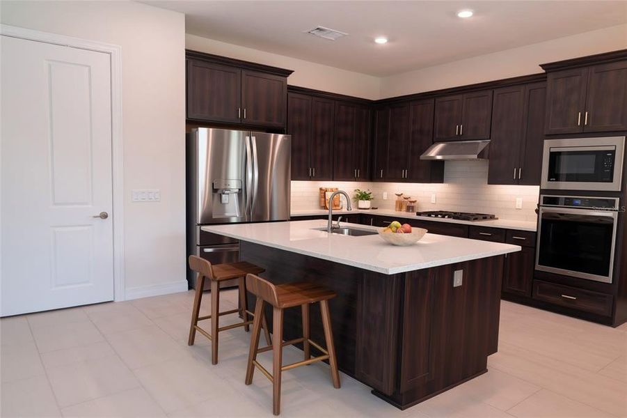 Furnished interior view inside a new home in Parkview Reserve, Orlando (Image 15).