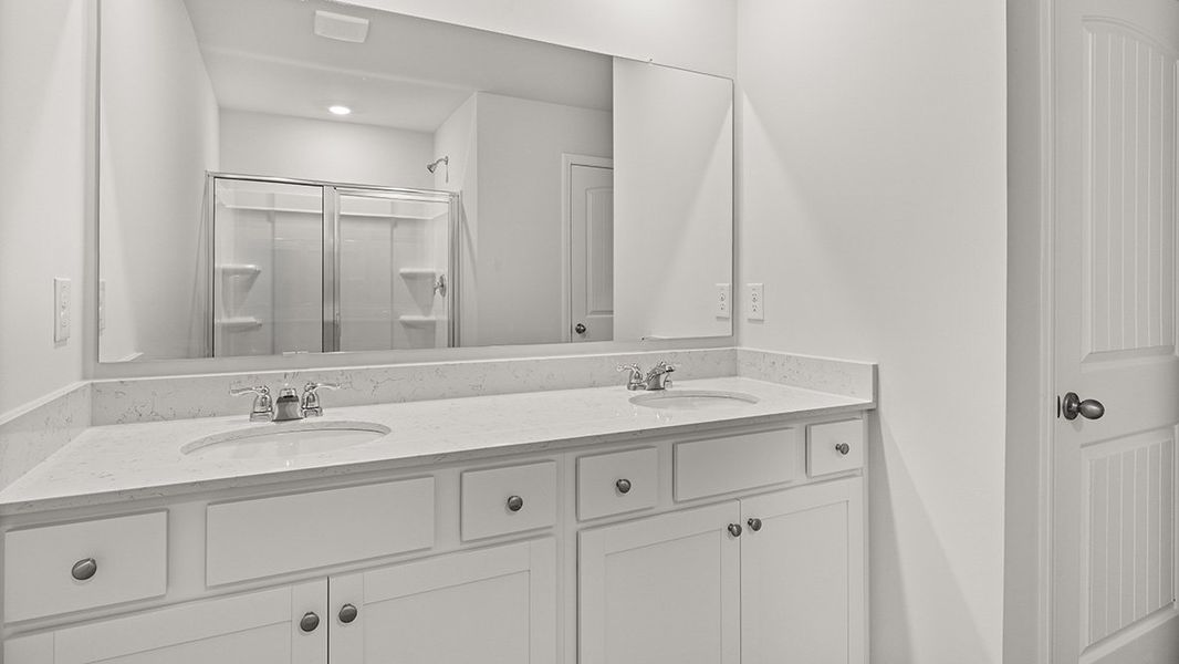 Representative furnished interior of a home built from the AMESBURY by D.R. Horton in Waypoint, Flowery Branch (Image 11).