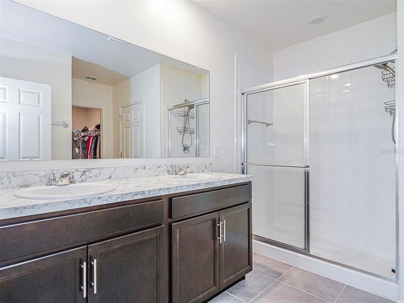 Double vanities and large walkin shower. Double vanities and large walkin shower.