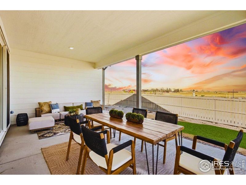 Extended covered patio with double slider doors.